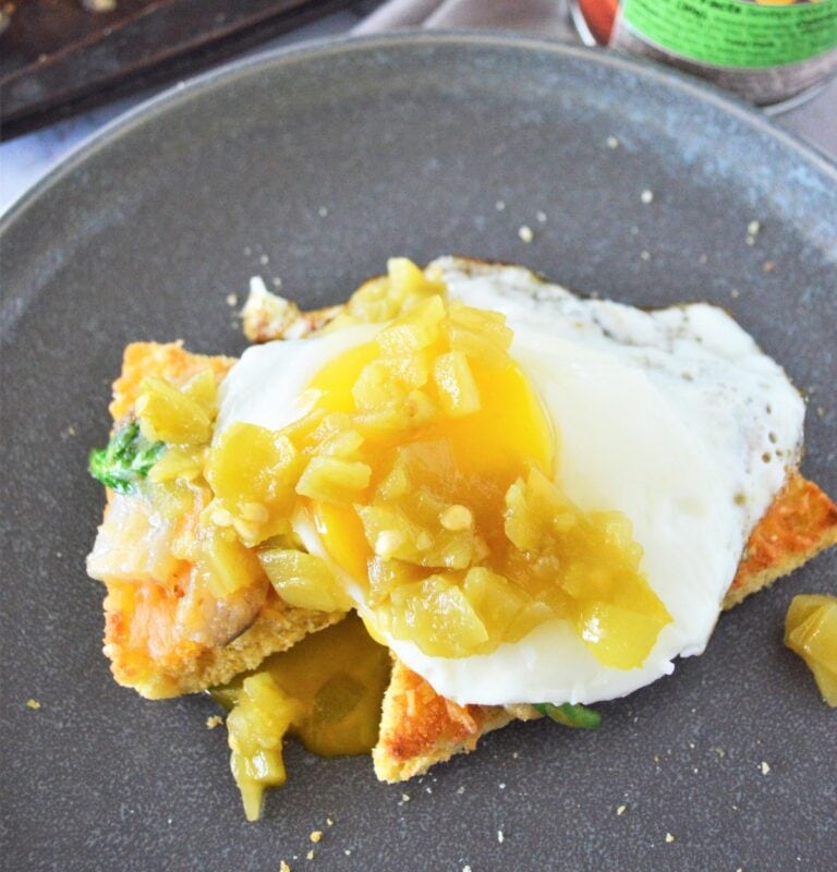 Green chile eggs on leftover cornbread.