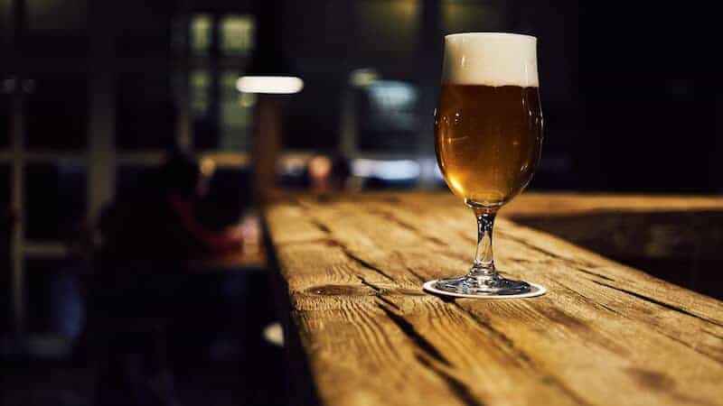 Draft beer on a wooden table. Credit Radovan on Unsplash