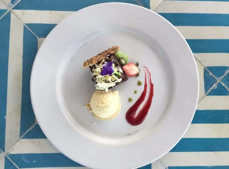 Dessert decorated with flowers served with ice cream at Villas Premiere Puerto Vallarta restaurant.