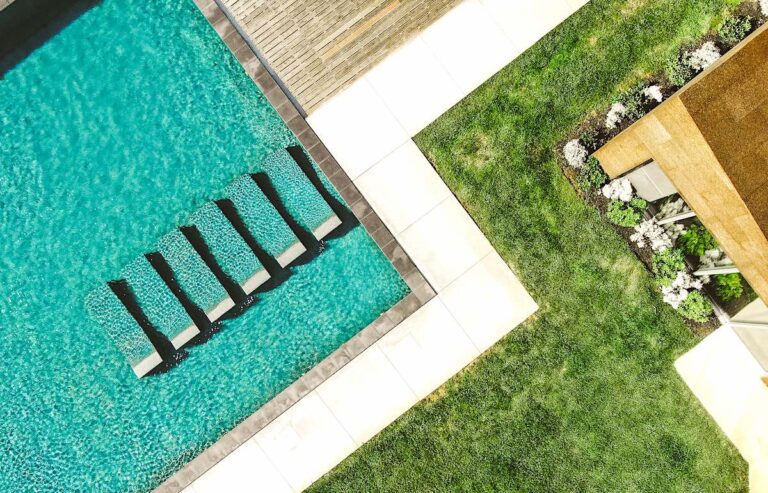 Drone shot of Santa Barbara Eco-Resort with swimming pool and rooftop.