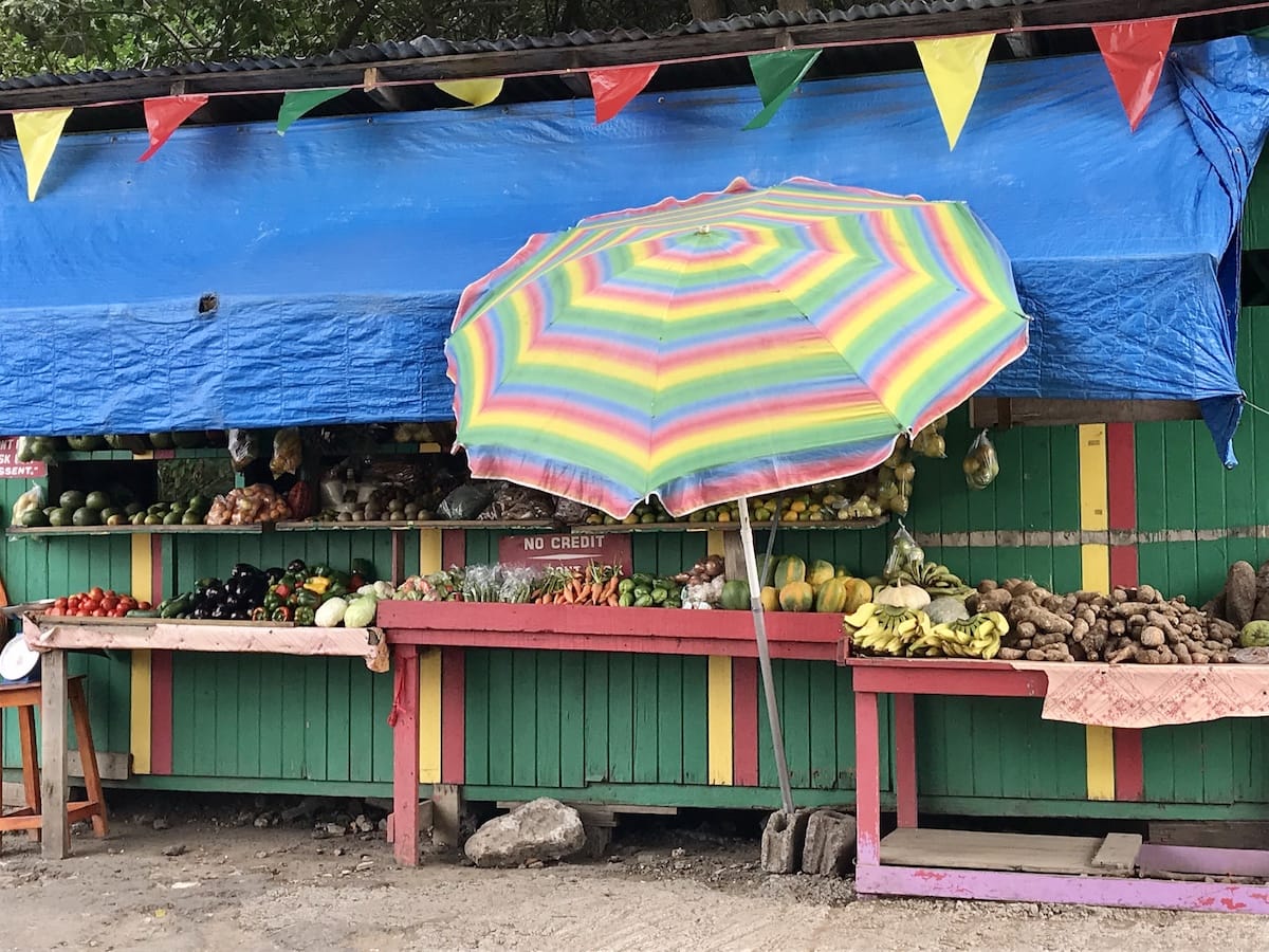 A fruit market with umbrella in Grenada. 