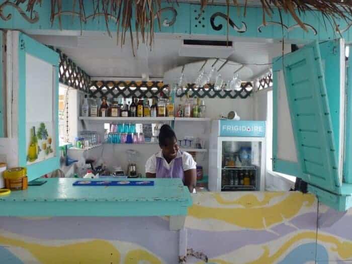 Young girl working at Annie's Kayak Kafe & Juice Bar in Hillsborough, Grenada.