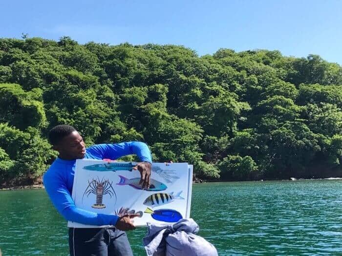 Guide Kimmie of Seafaris Adventure tour shows participants the marine life at Underwater Sculpture Park