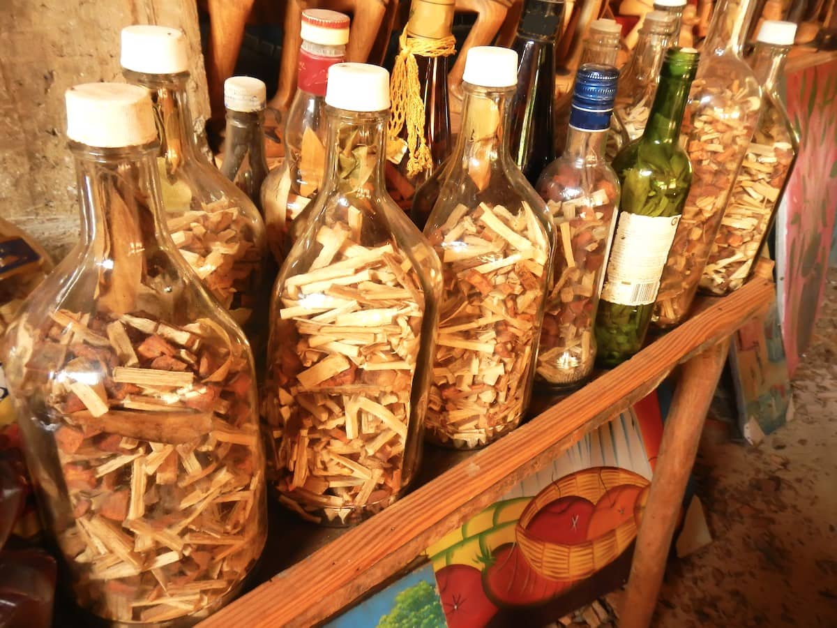 Display of bottles containing Mama Juana root, spice and bark mixture.