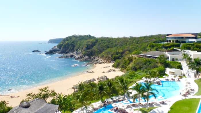 View of the beach looking west from Secrets Huatulco Resort in Conejos Bay