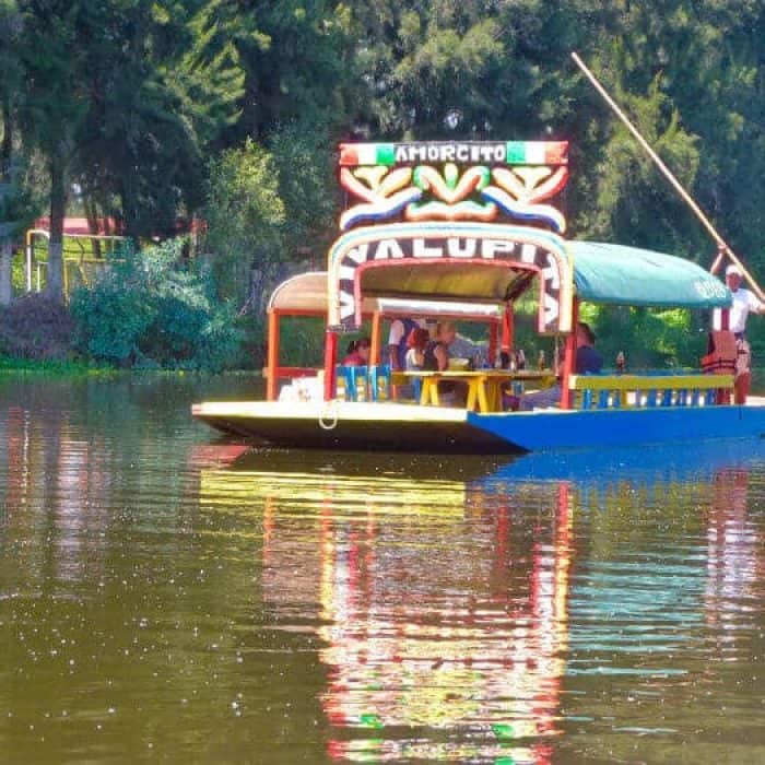 A trajinera or Mexican gondola in Xochimilco Mexico City.