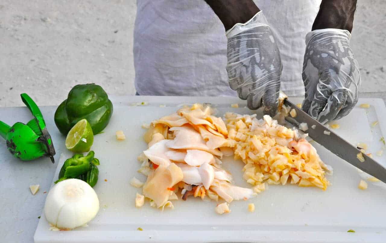 Chef preparing conch in the Caribbean. 