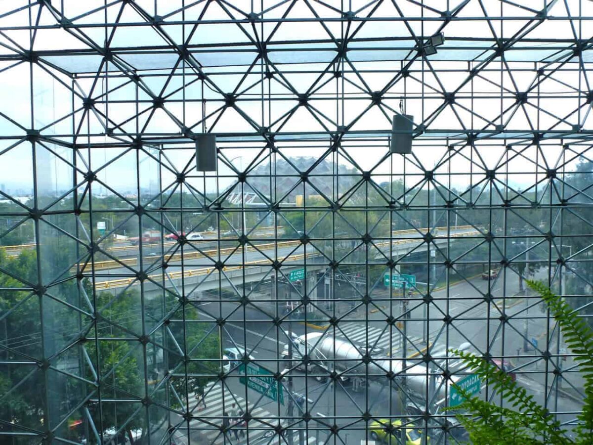 .The geodesic dome of Palacio de los Deportes ( Sports Palace) seen through the courtyard of the Grand Prix Hotel Mexico City.