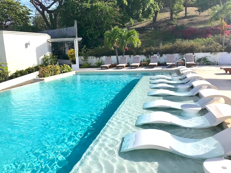 Swimming pool at Calabash Hotel on a sunny day. 