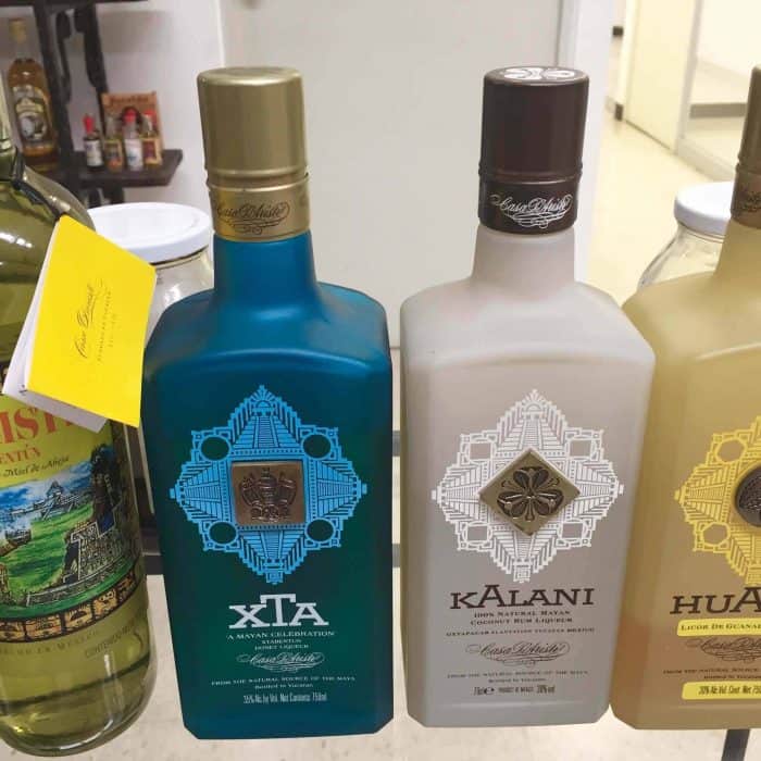 Bottles of Xtabentun on a shelf. 