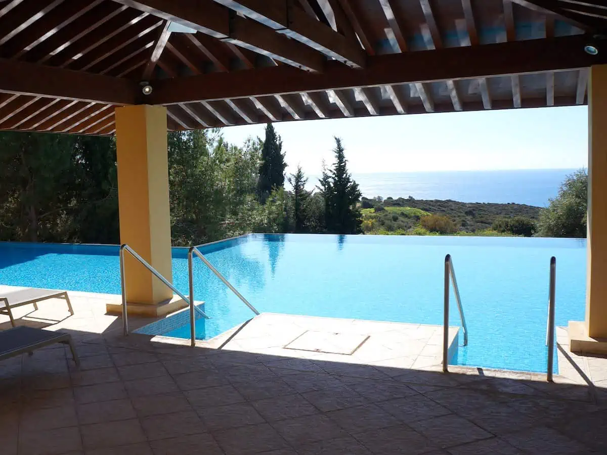 Pool at Aphrodite Hills Resort with a view of the sea. 
