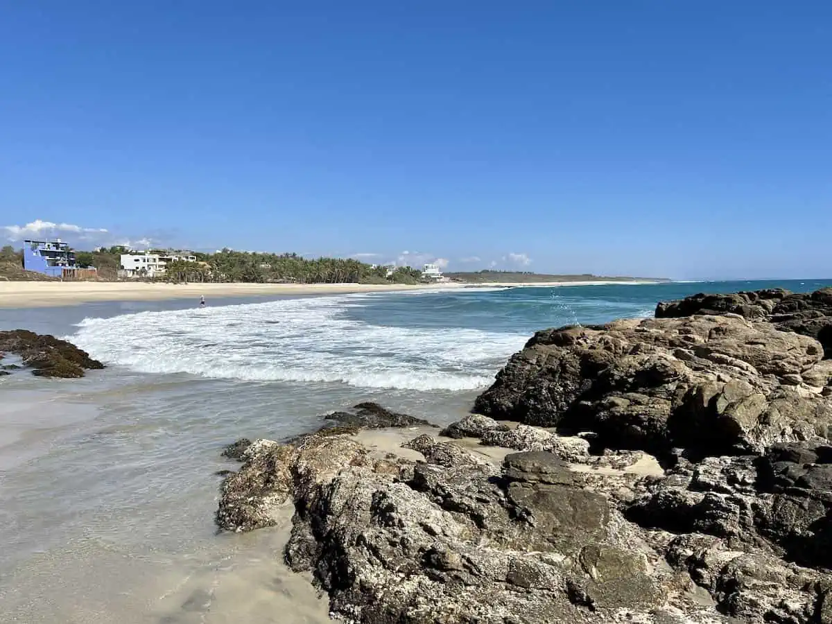 Playa Agua Blanca with a few hotels in the distance.