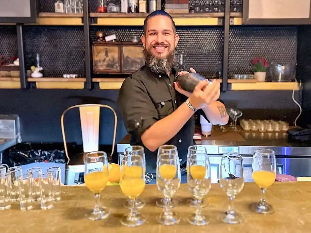 Bartender Marco Rodrigez at Atelier Cocina Abierta making a cocktail.