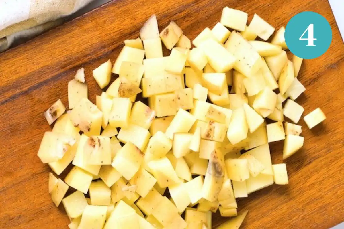 Potatoes chopped on a cutting board.