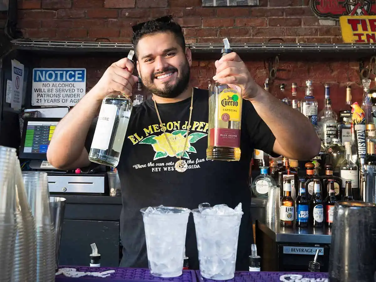 Bartender with Liquor Bottles at Meson de Pepe's.