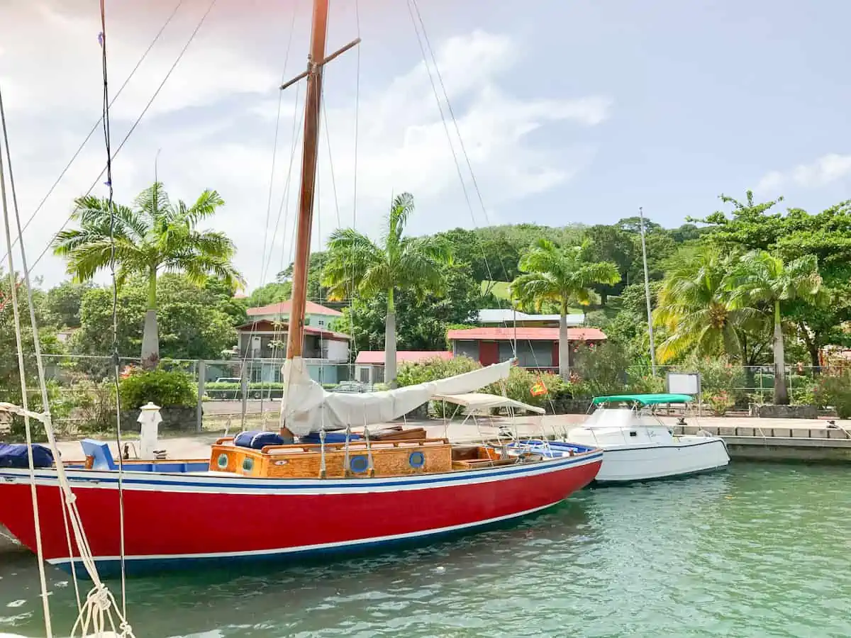 Savvy Sailing sloop in a marina in Grenada.