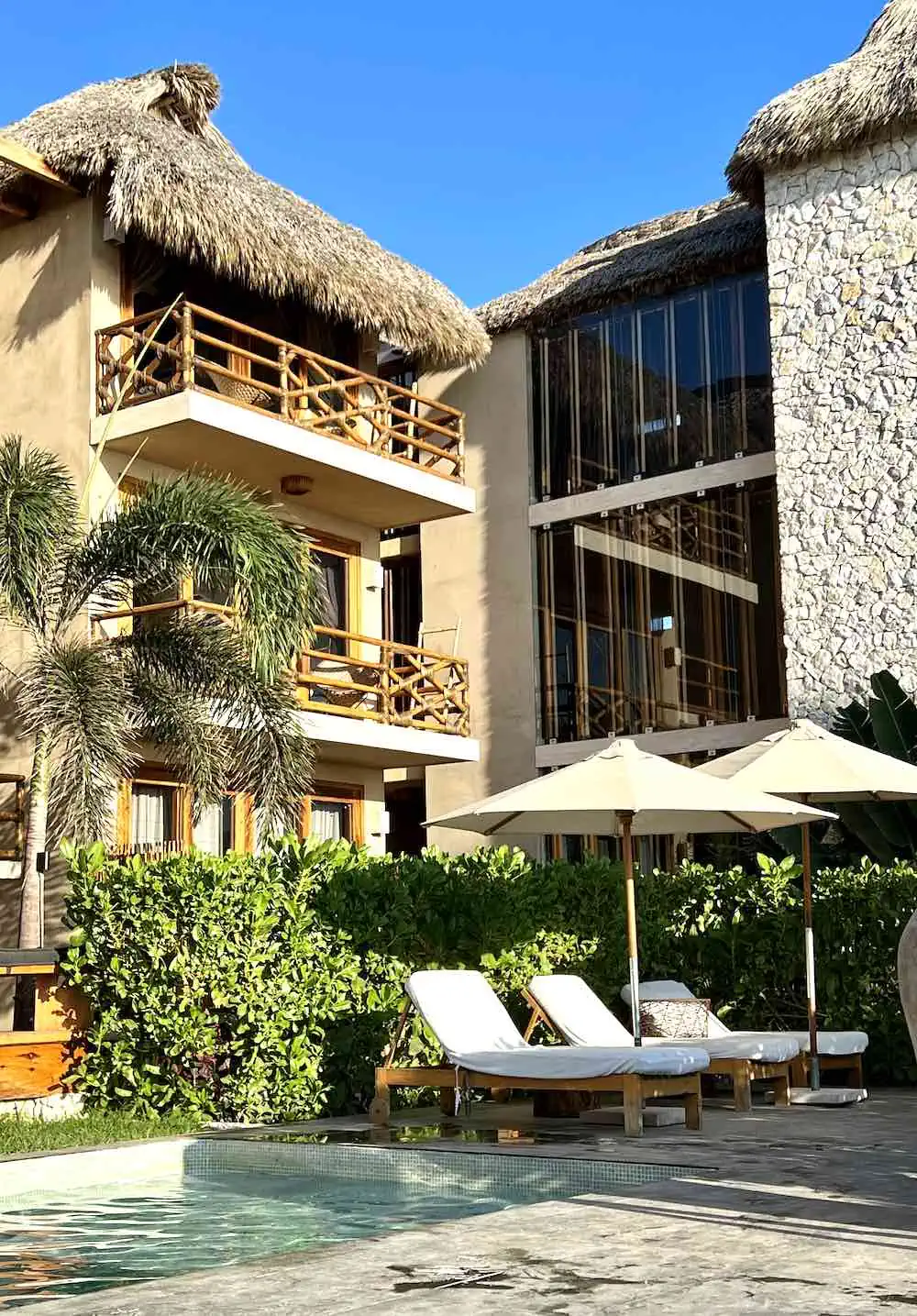 Swimming pool and balconies of Casa Joseph Zicatela a top hotel on the beach in Puerto Escondido. 