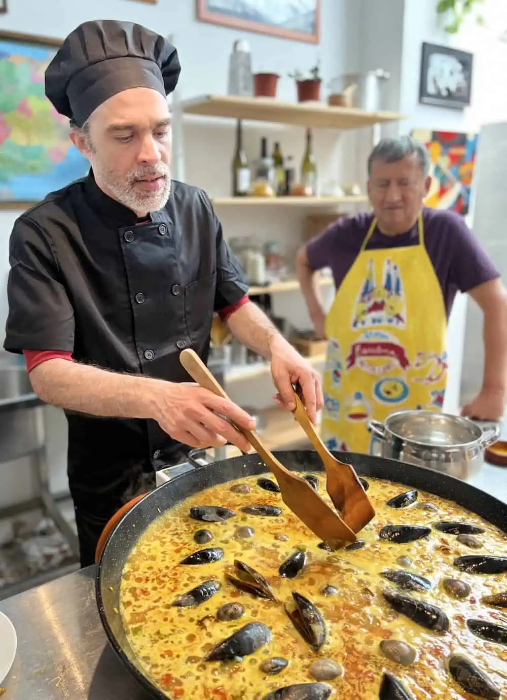 Chef Gabriel demonstrating cooking techniques at Gastronomic Arts Barcelona.