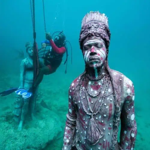 Scuba diver installing a new sculpture at the Grenada Underwater Sculpture Park.