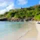 View of Deep Bay Beach in Antigua on a sunny day.