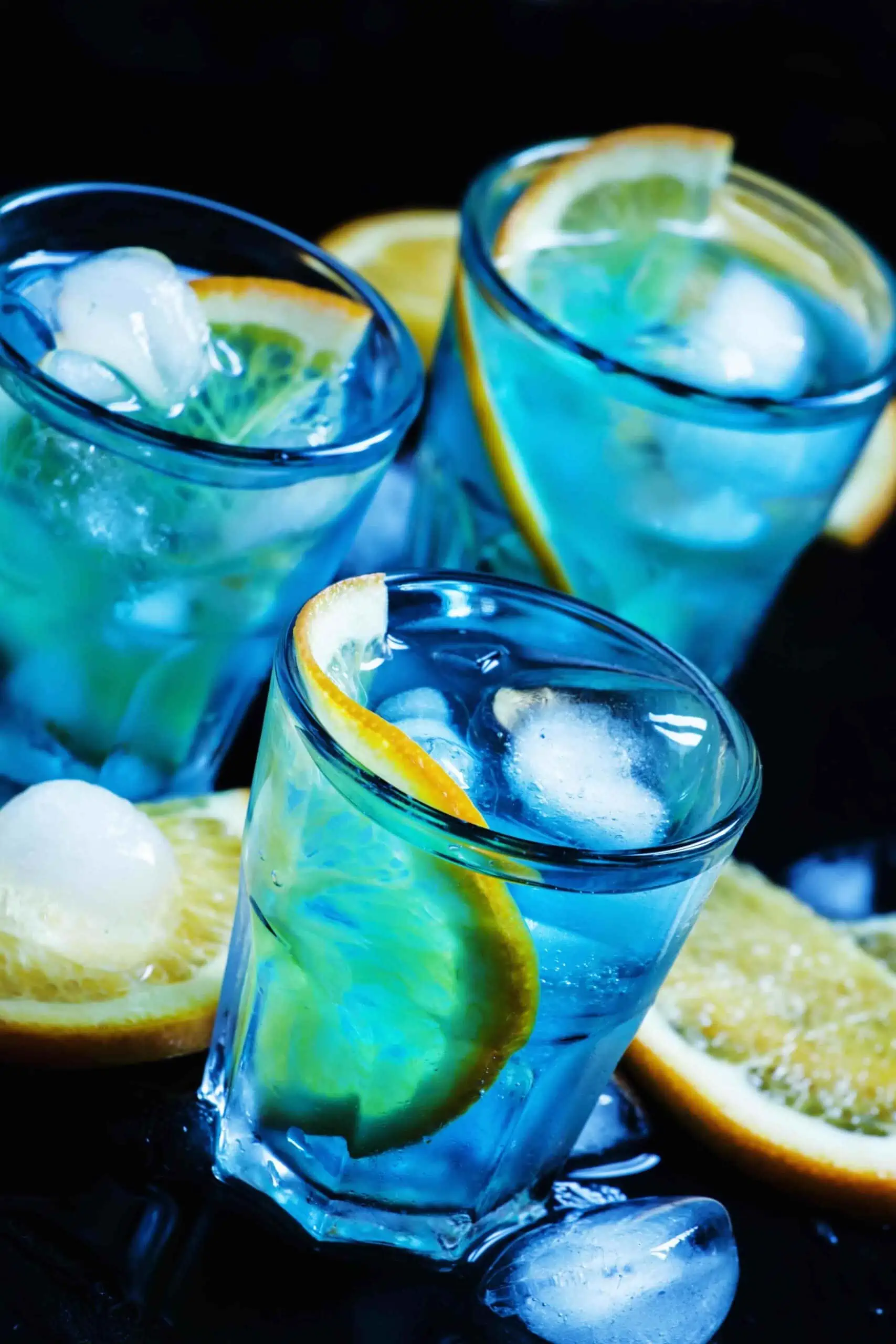 Blue cocktail with orange and crushed ice.  