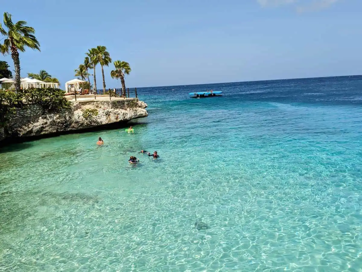 Dreams Curaçao Resort swimmers in the ocean.