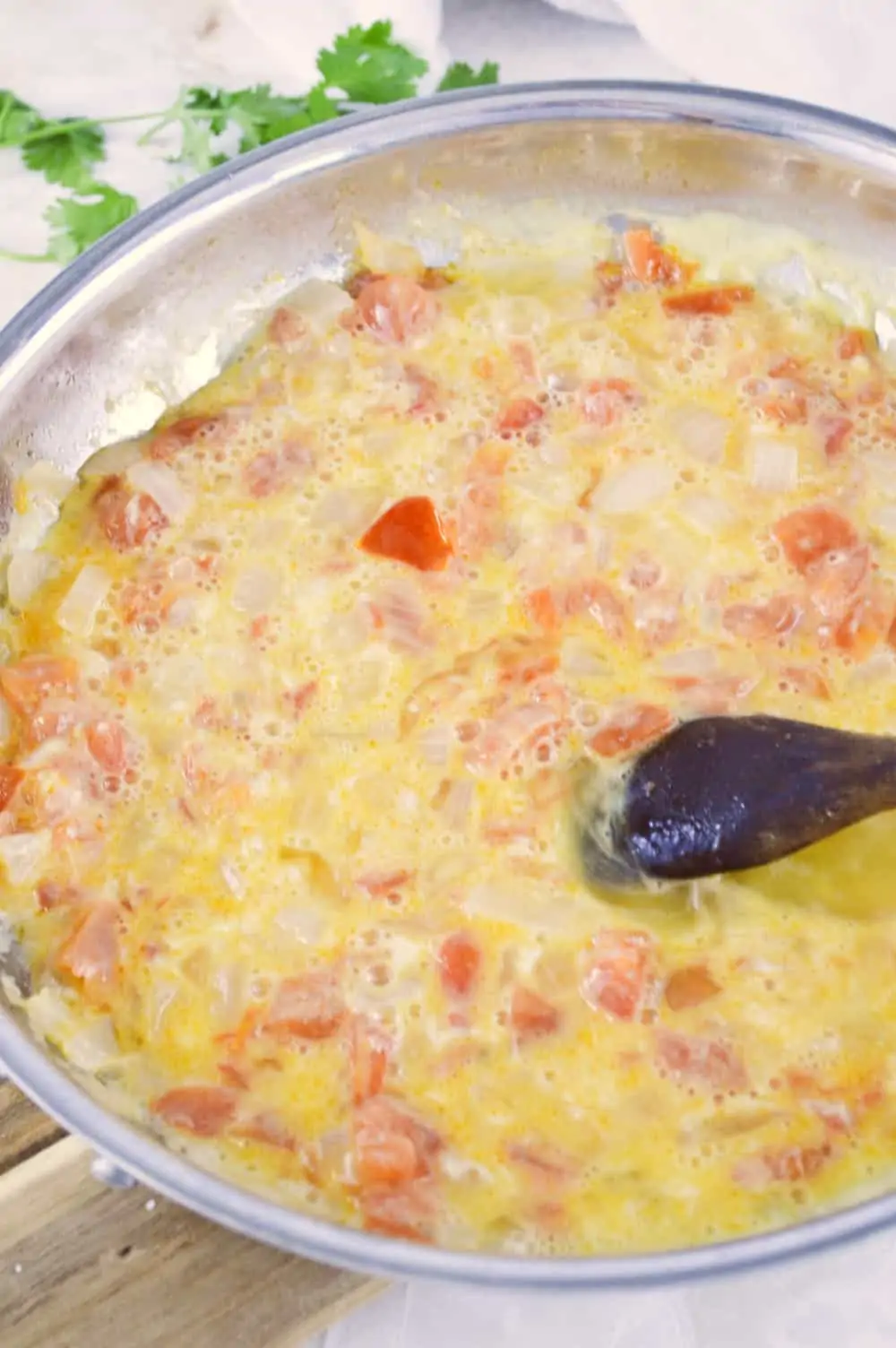 Eggs cooking in a skillet.