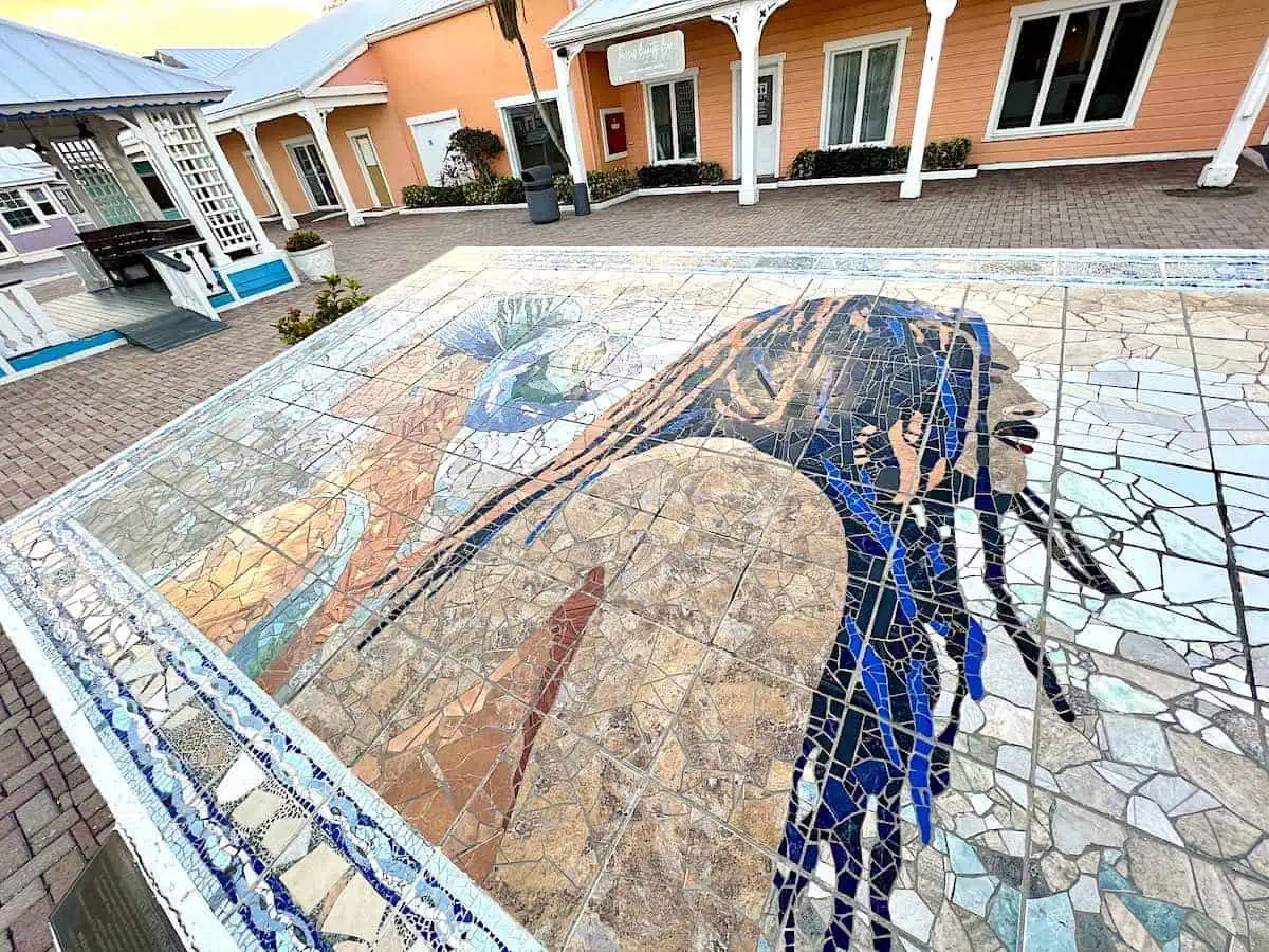 Art mosaic of a Bahamian man and woman at Port Lucaya Marketplace. 