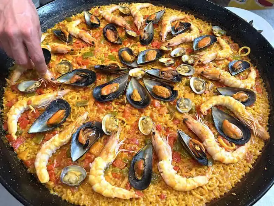 Seafood paella in a pan at a Barcelona cooking school.