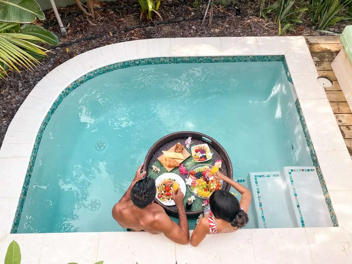 A couple with a floating brunch in Aruba.