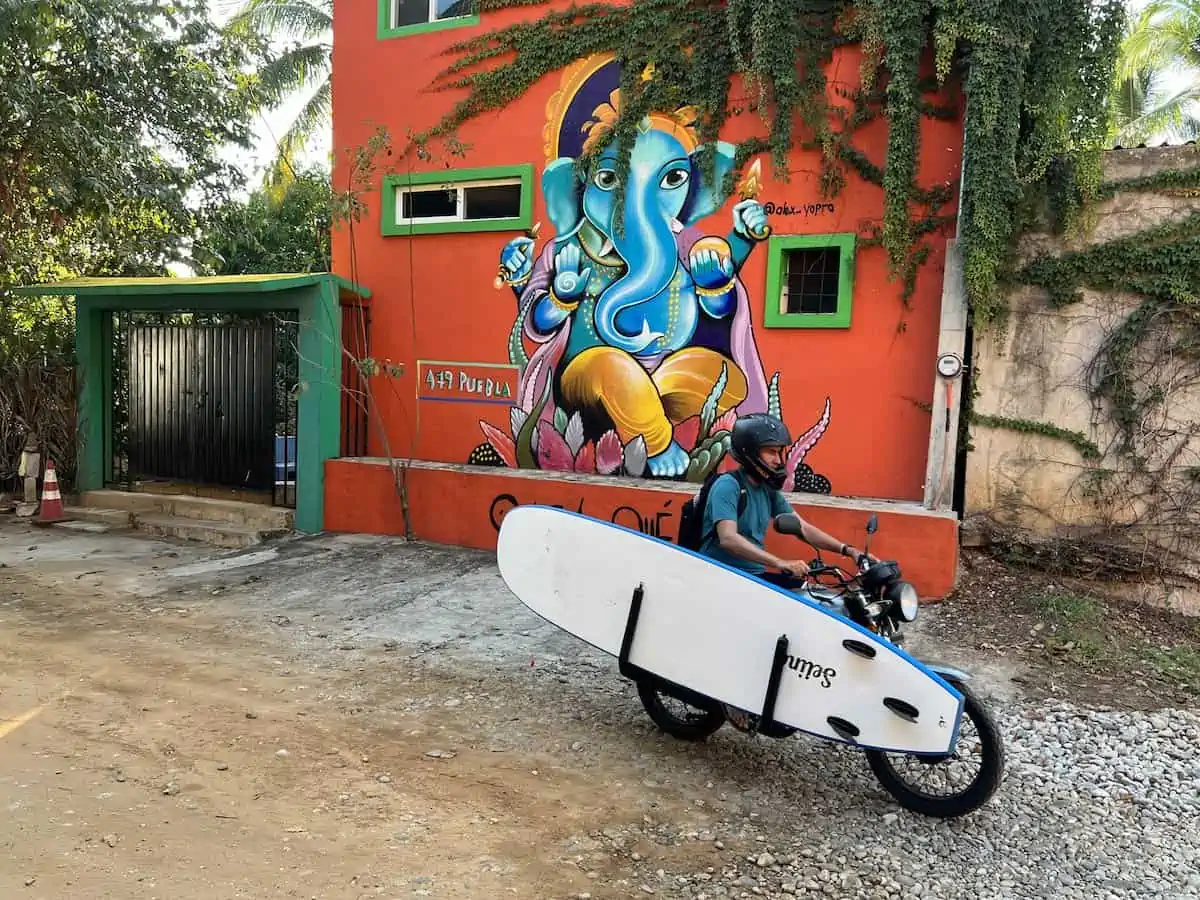 Surf board on a scooter in Puerto Escondido, Oaxaca. ing