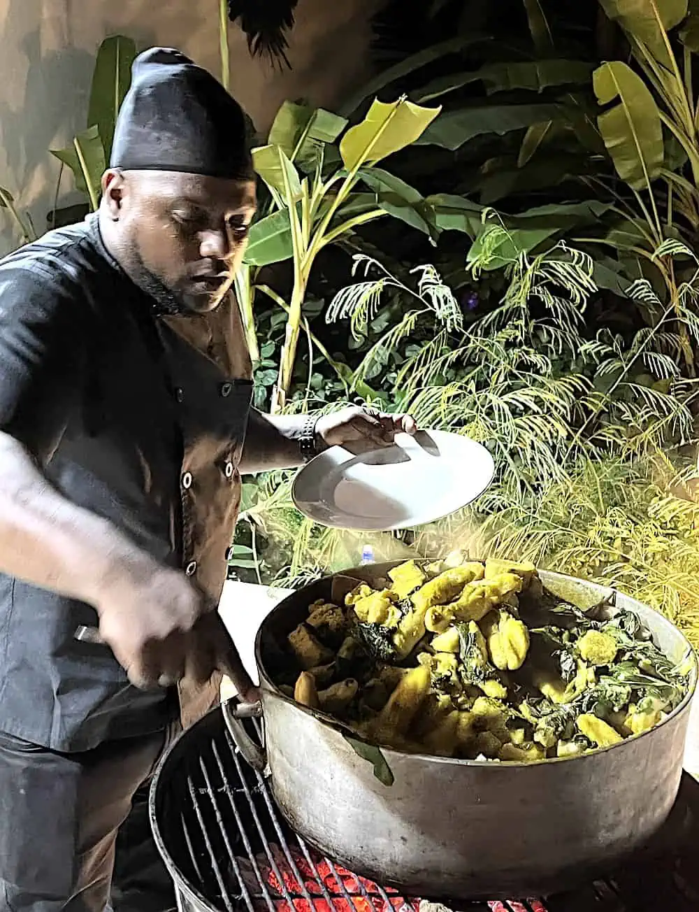 Chef stirring a pot of Grenadian oil down at the Royalton Grenada. 