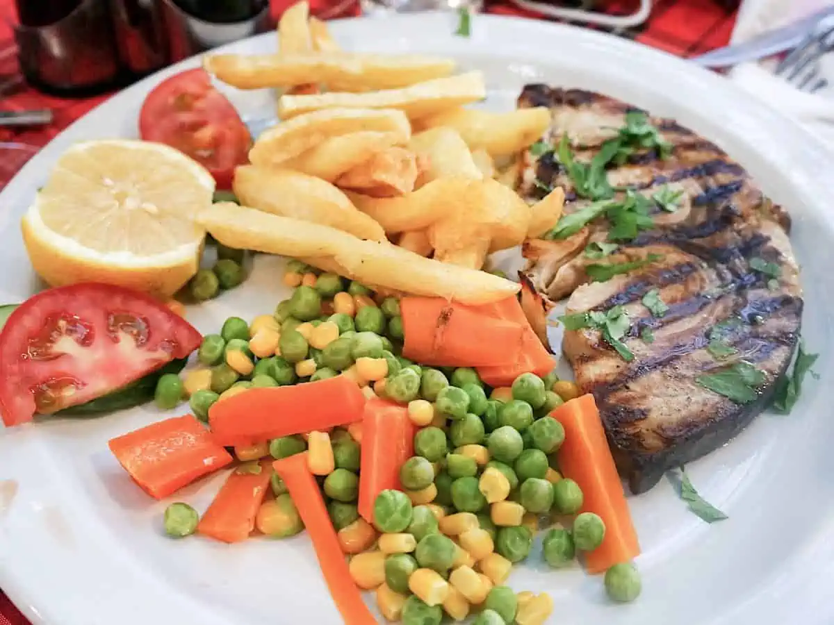 Grilled swordfish with vegetables.