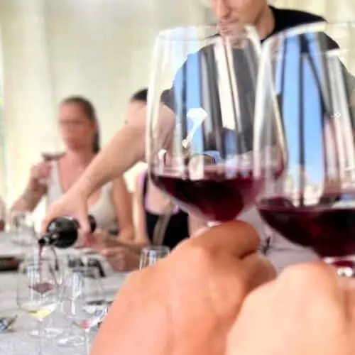 A group of people at a wine tasting in Santorini.