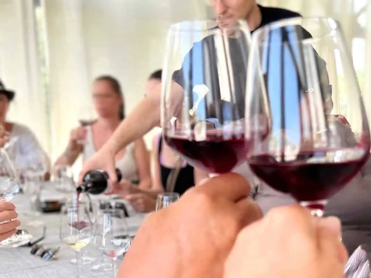 Group of people on a wine tasting tour in Santorini Greece. 