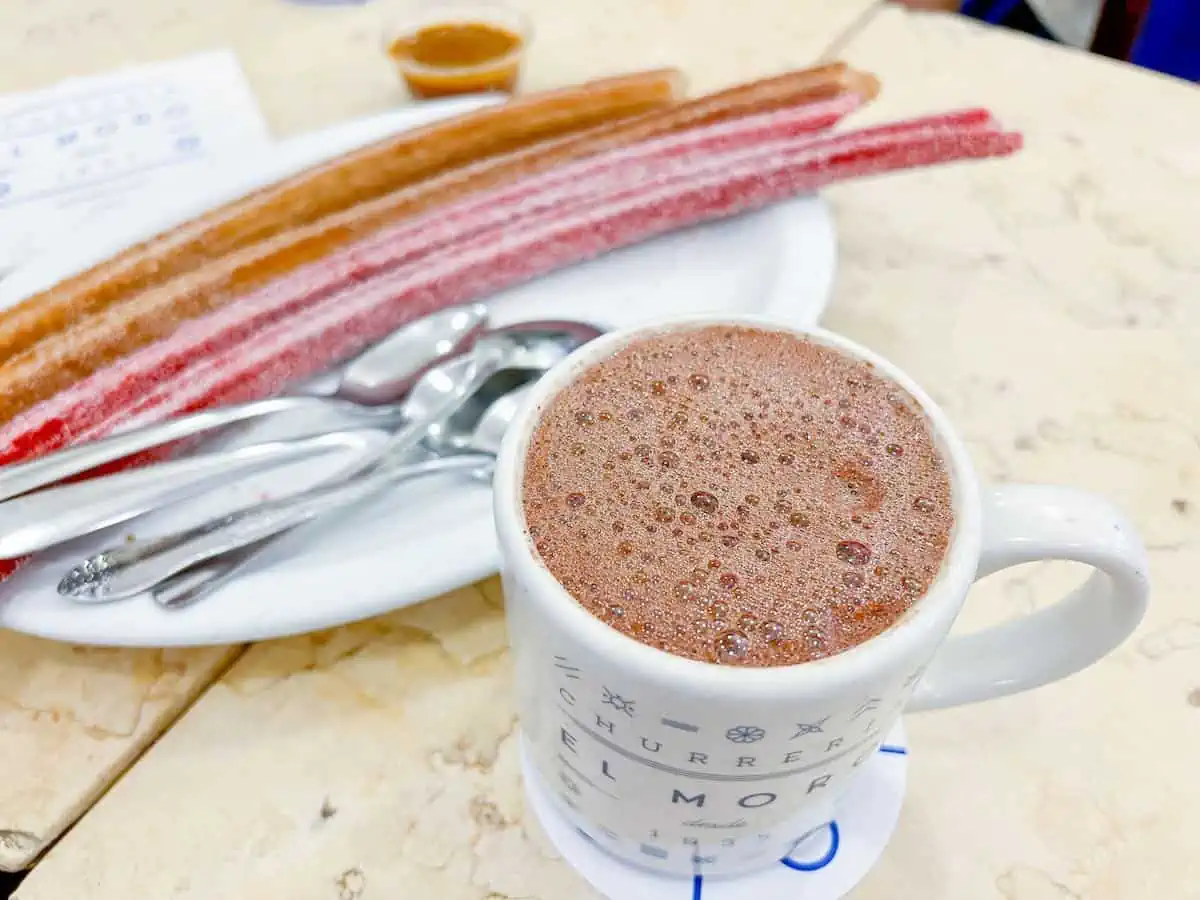 A mug of hot chocolate and some churros at El Moro Churreria in Mexico City. 