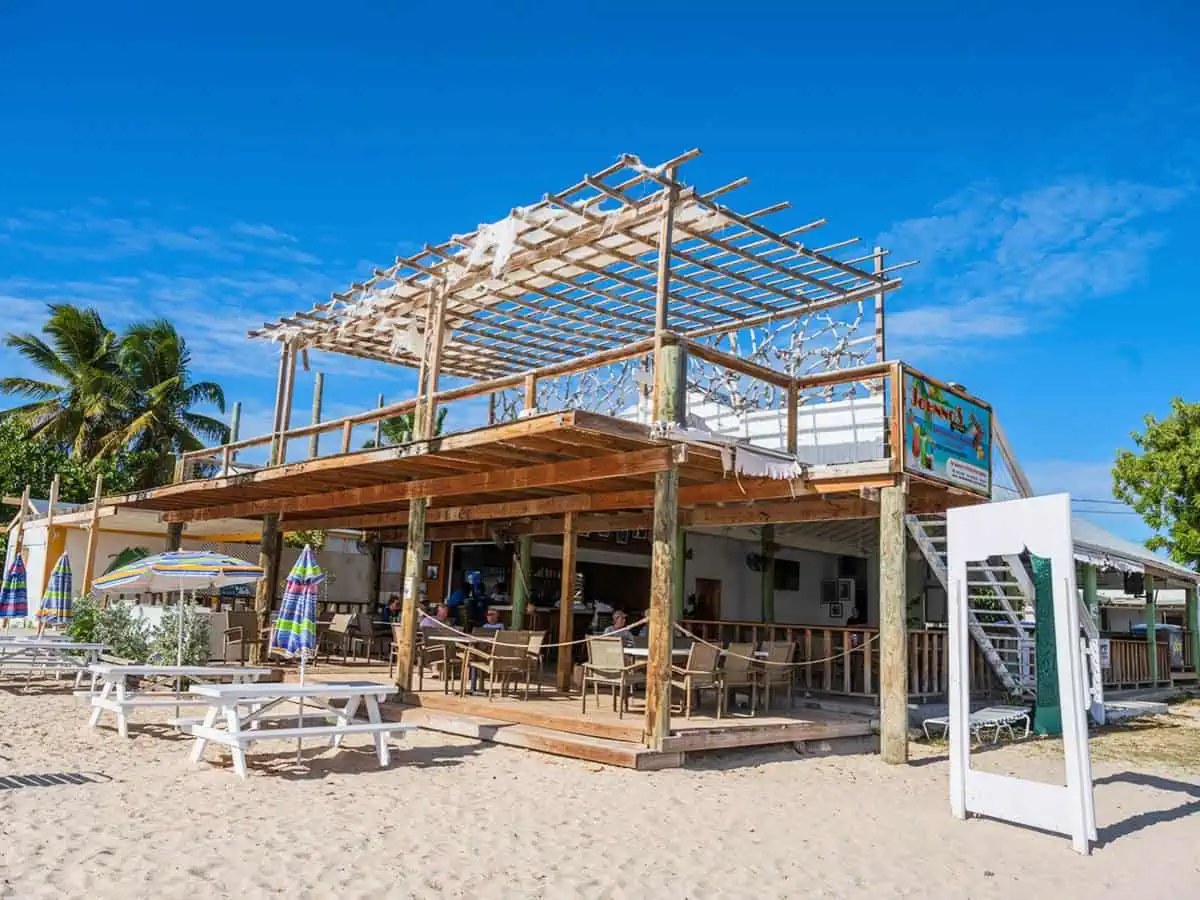 Beach front bar with picnic tables.