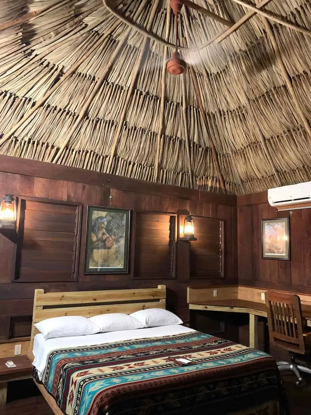 Interior of a thatched roof cabana at Lamanai Outpost Lodge in Belize..