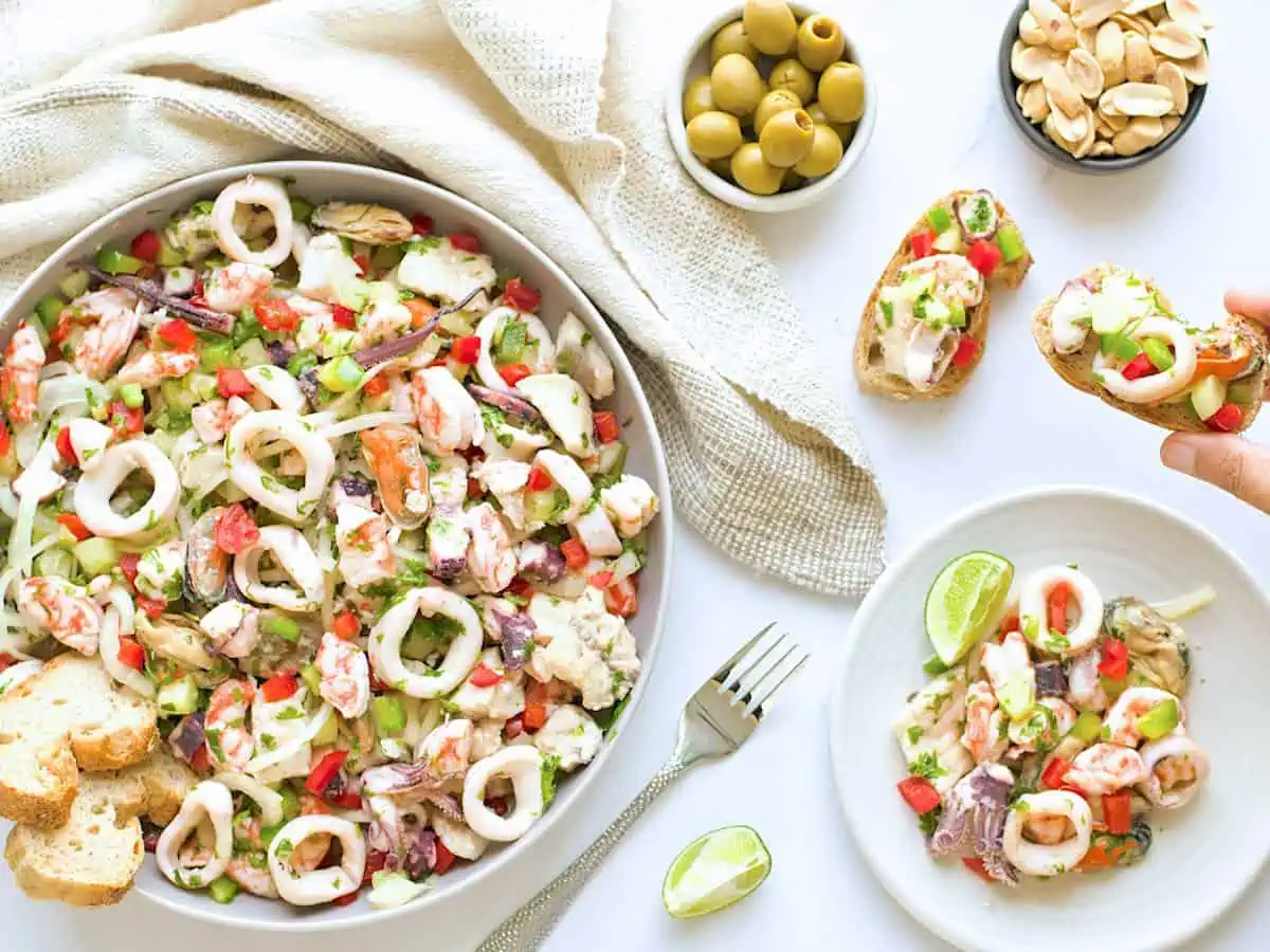 Salpicon de marisco on a white table served as a tapas salad.  