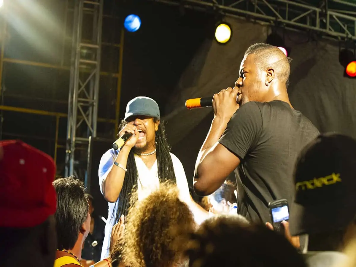 Two male entertainers singing at Shirley Heights Antigua party.