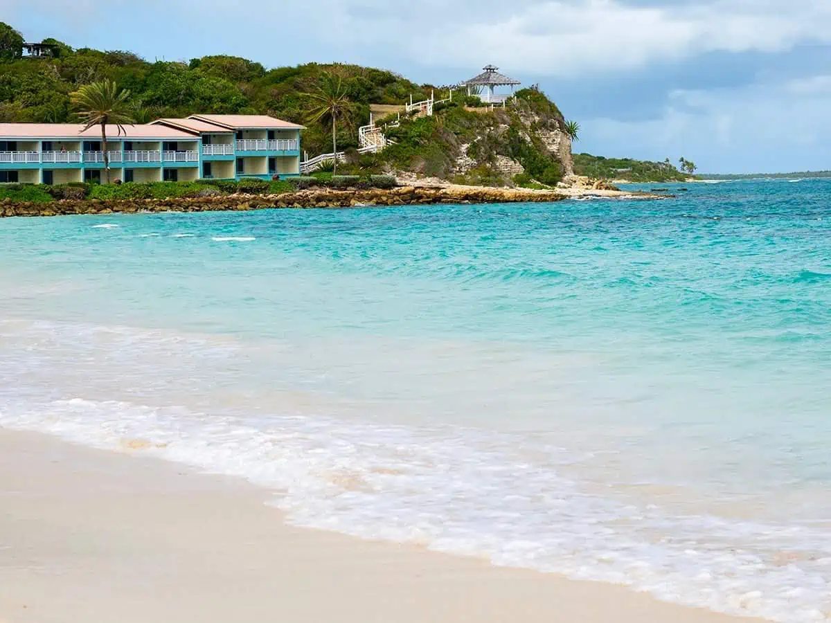 Ocean with views of resort on a hilltop.