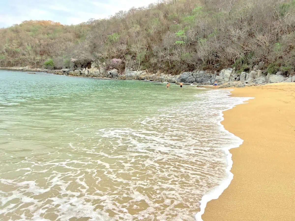 The rocky outcroppings are the best place to snorkel at Bahia de Maguey.