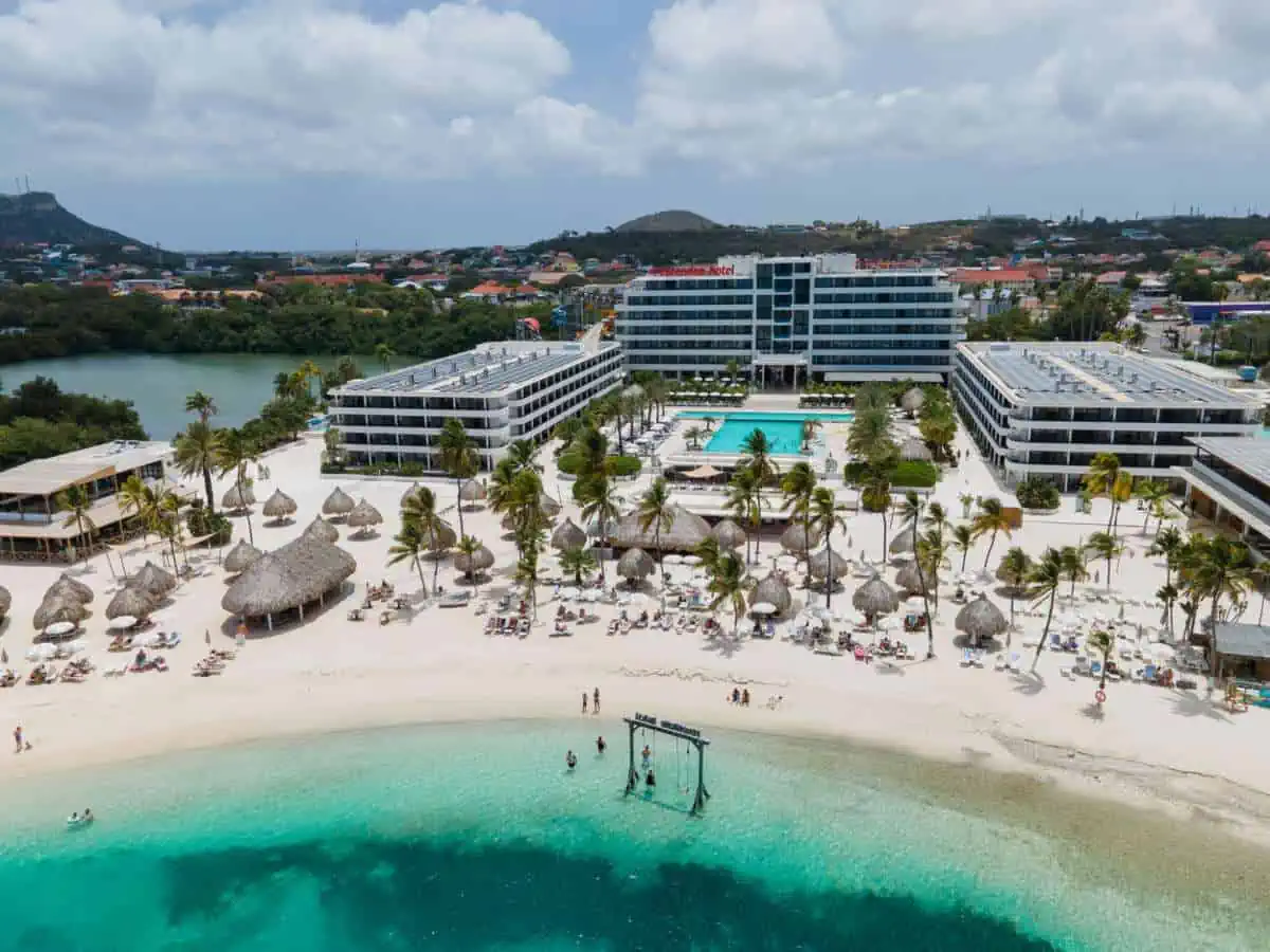 Aerial view of Mangrove Beach Corendon Curaçao an all-Inclusive Resort with ocean and sand. 