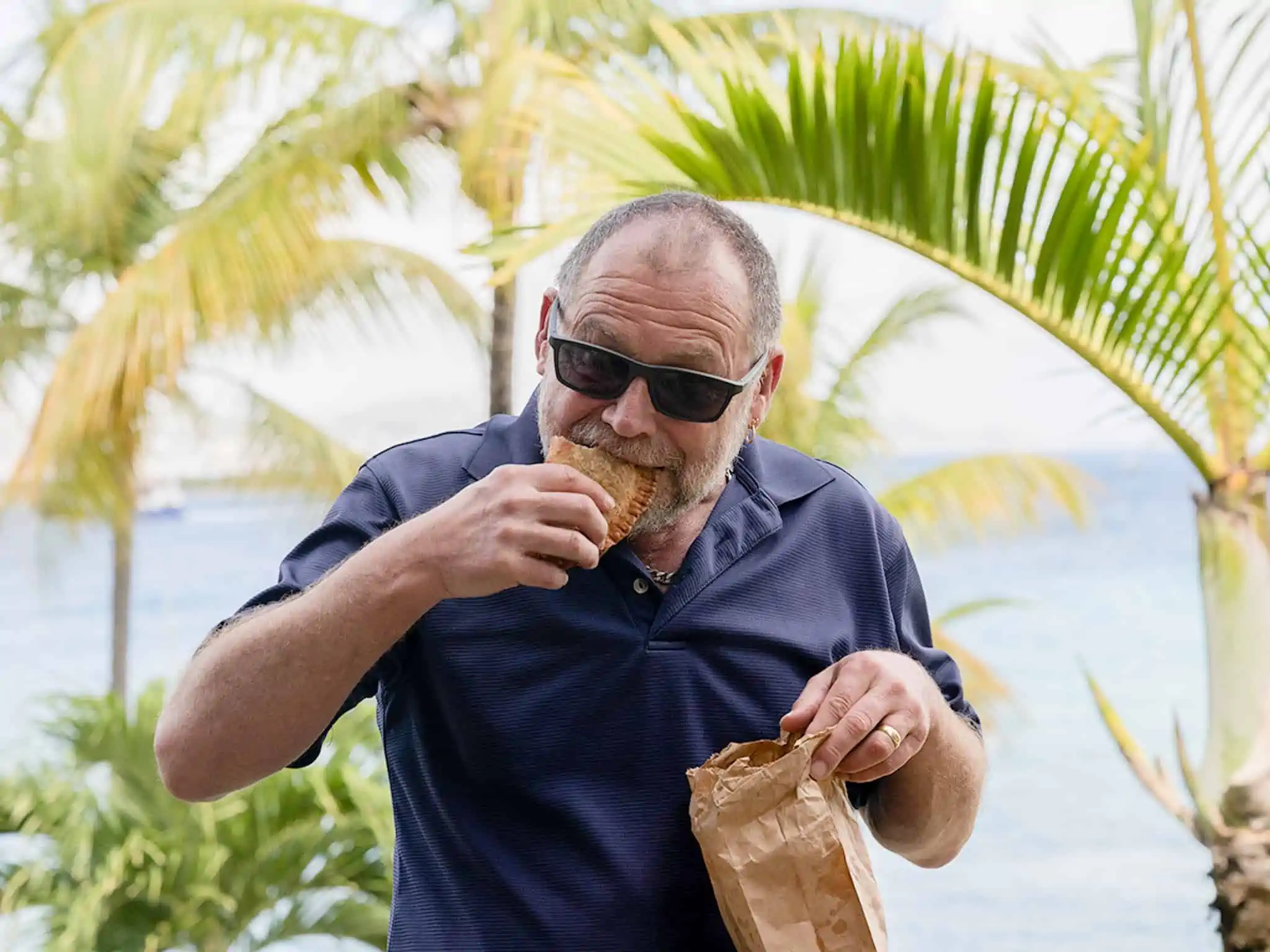 Writer Mark Stevens eating on USVI.