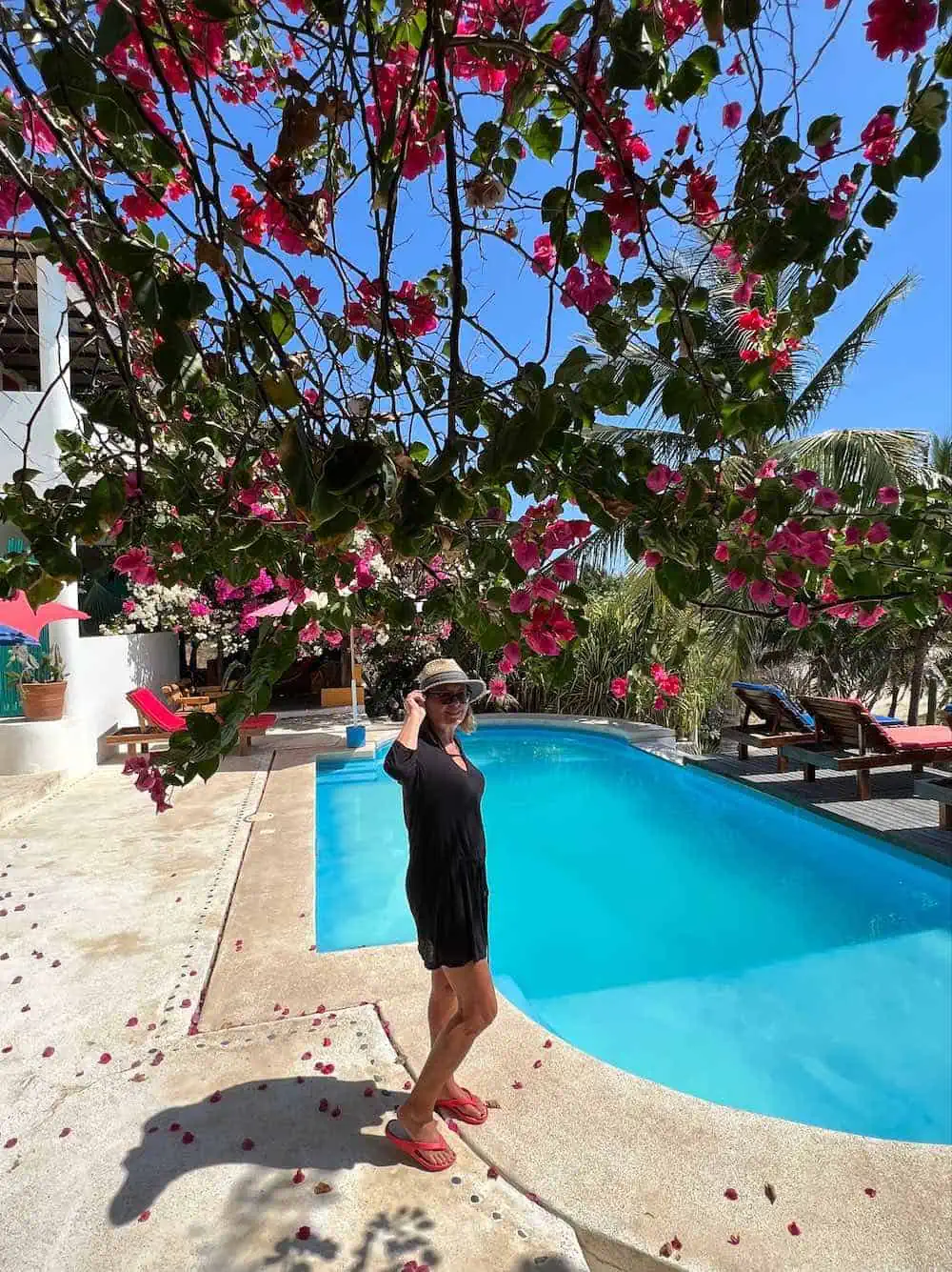 Travel writer Michele Peterson at poolside at Beachfront Paradise Boutique Hotel. 