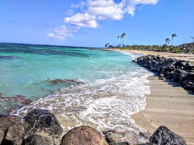 Rocks and blue waters of Nisbet beach Nevis in January 2019. 