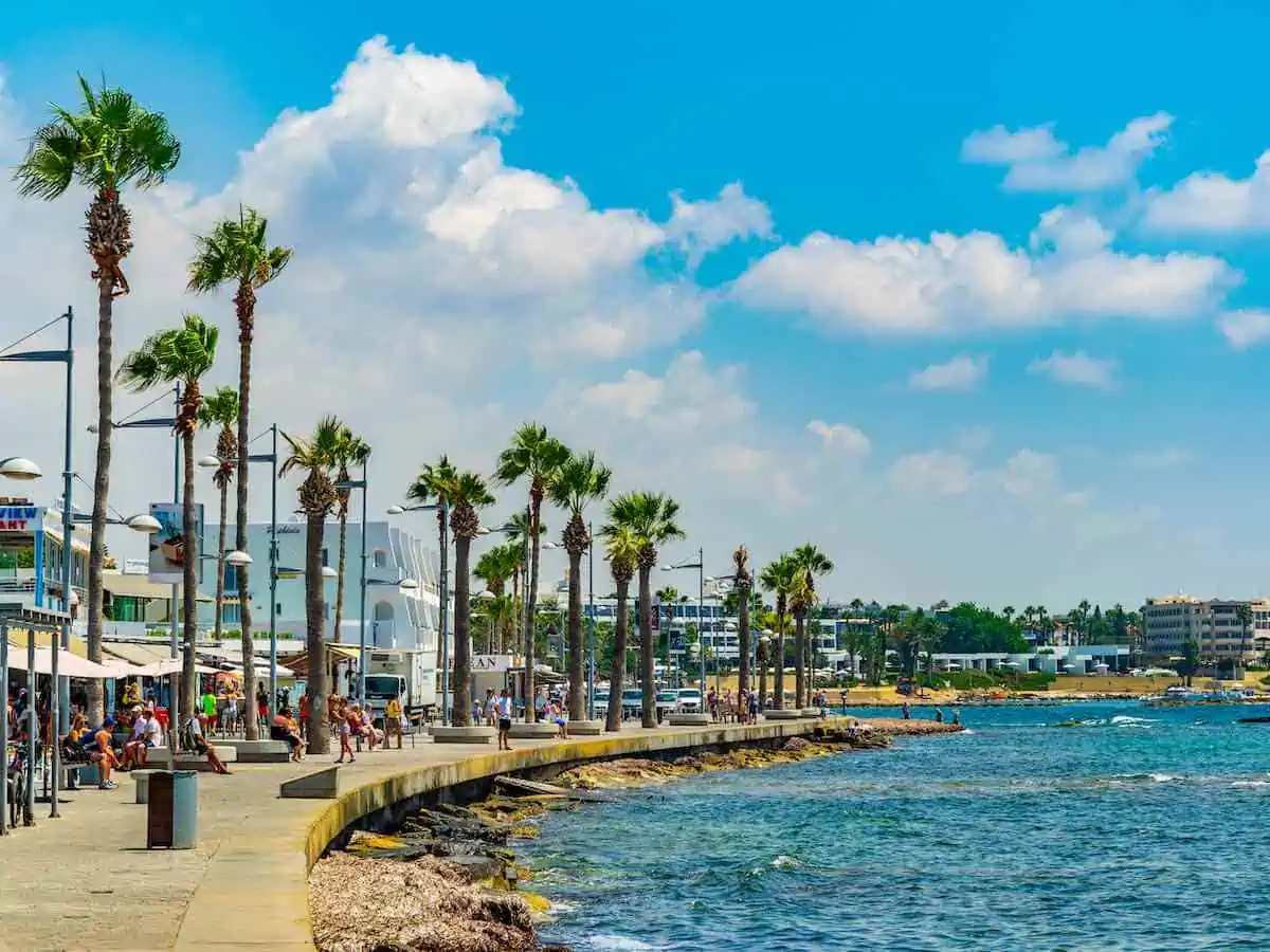 Palm trees, promenade and restaurants in Paphos, Cyprus.