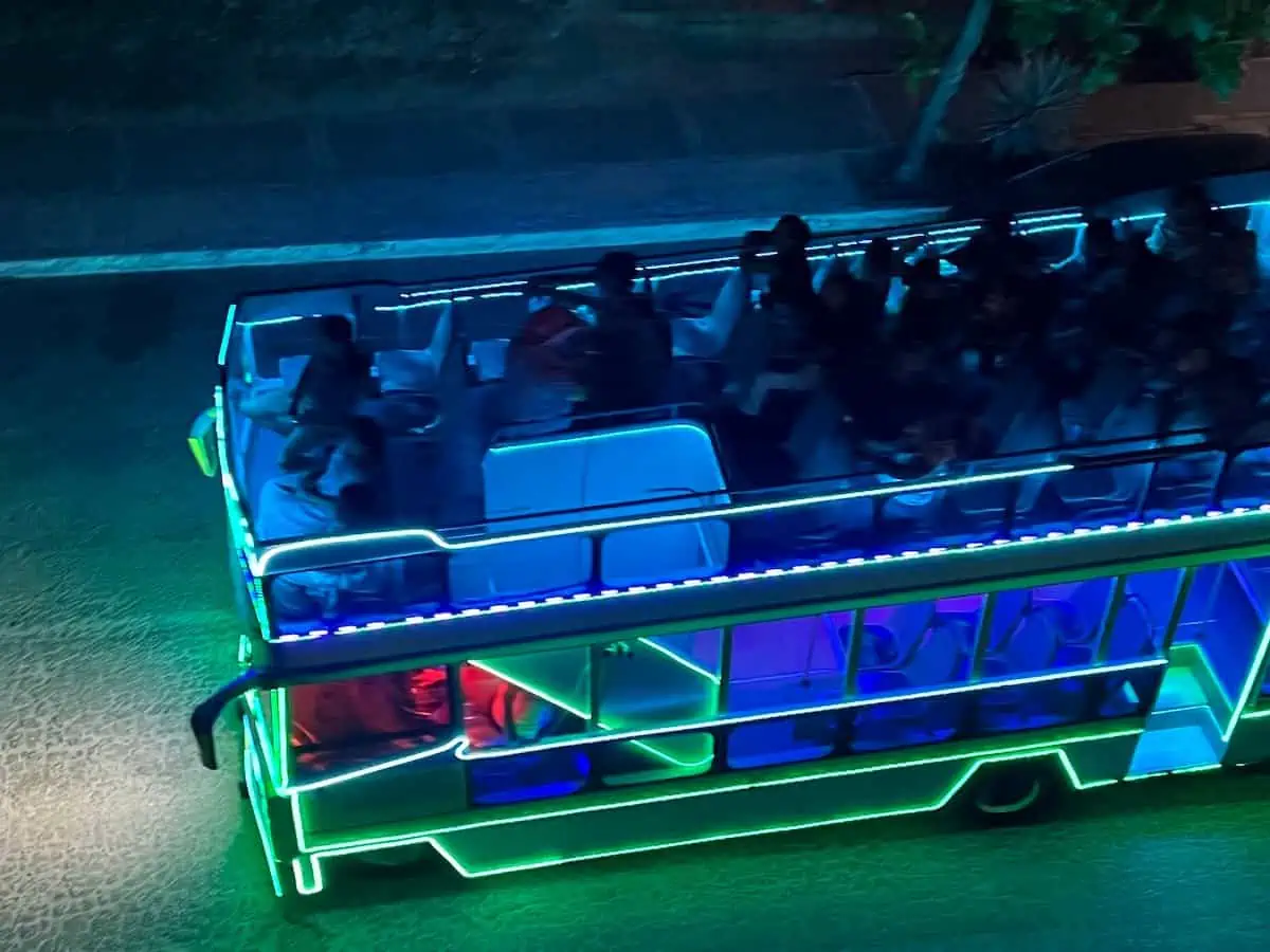 People riding the party bus  of Huatulco at night. 