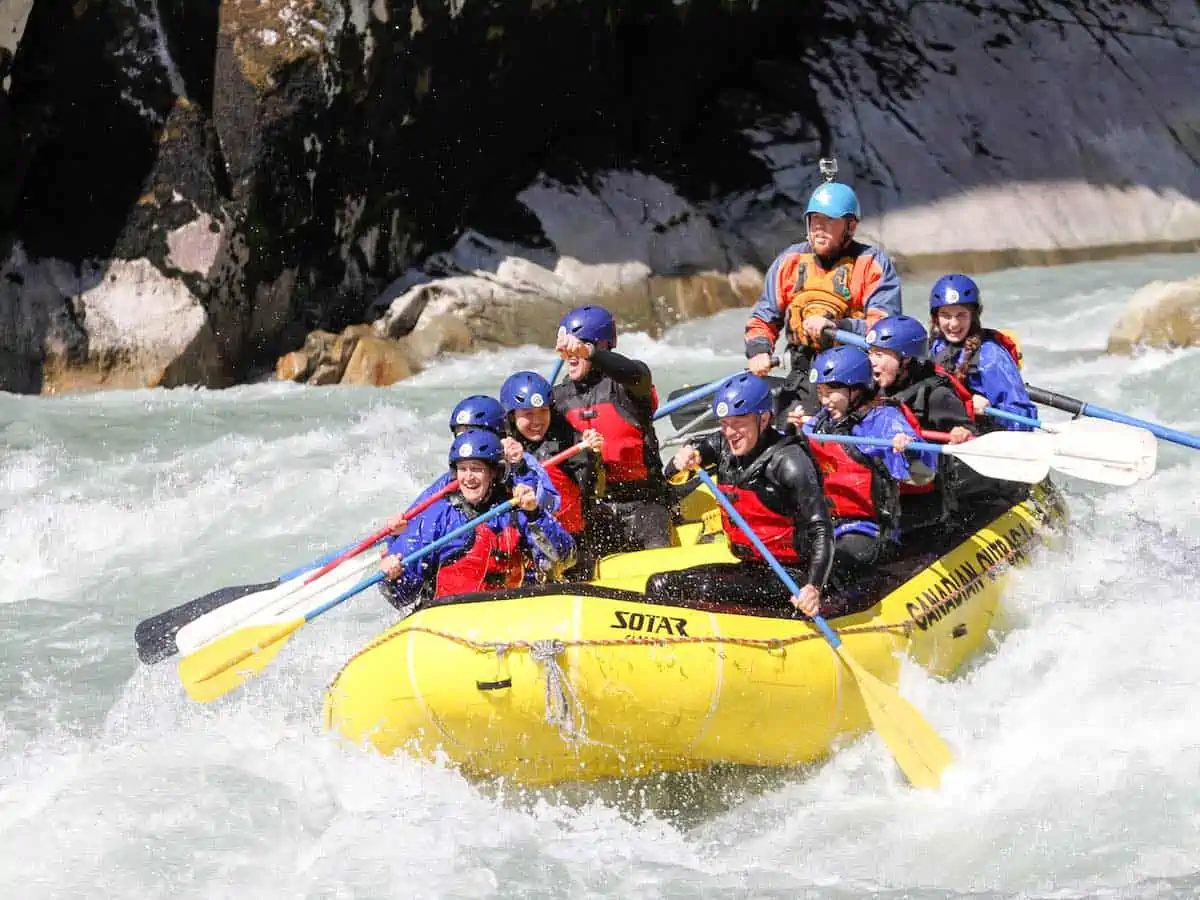 Group of people in a yellow raft in Whistler.