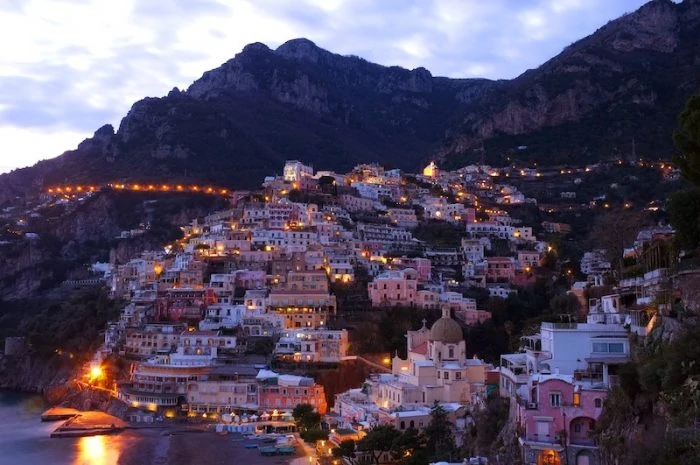 View of romantic Positano at night. Credit: yoosun-won-unsplash